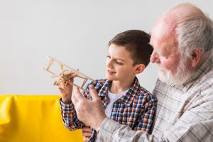 grandfather-and-grandson-playing-toy-plane.jpg